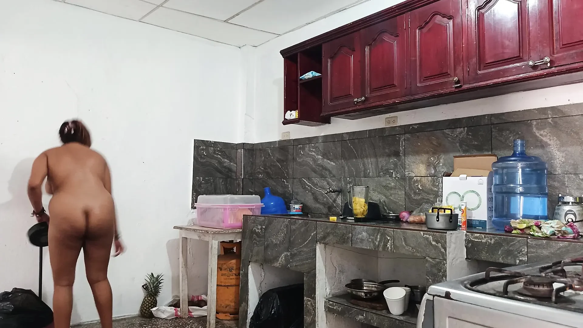 18+ year old girl with perfect tits completely naked in the kitchen. Real homemade video.